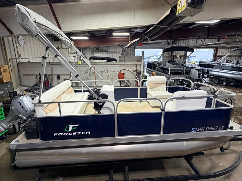 Slide: The Image of 2019 Forester 14' Fish n Fun Pontoon displayed indoors. - 4