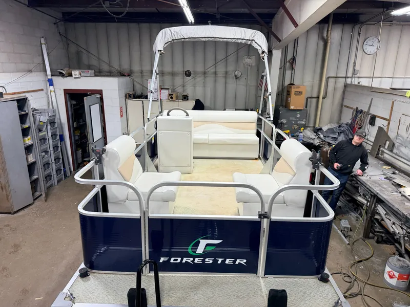 Slide: The Image of 2019 Forester 14' Fish n Fun Pontoon in workshop area. - 7