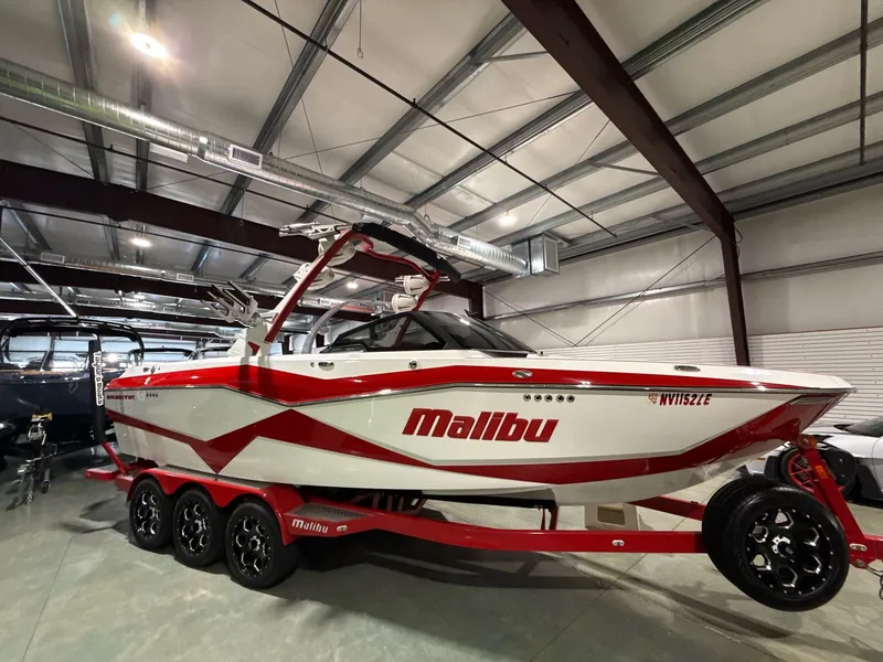 The Image of 2022 Malibu Wakesetter 25 LSV boat in warehouse. - 1