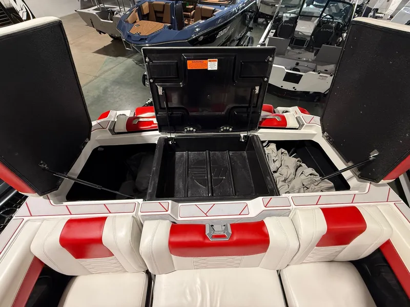 Slide: The Image of Interior of 2022 Malibu Wakesetter 25 LSV with storage compartment. - 11