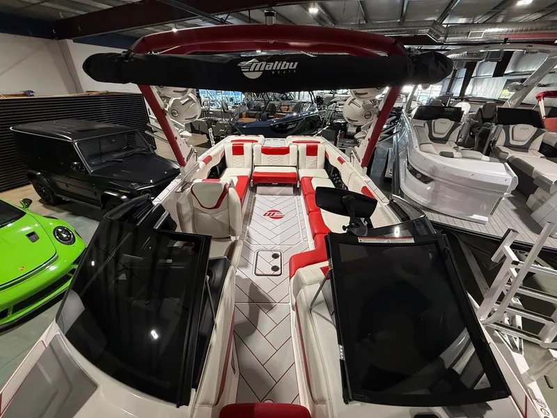 Slide: The Image of 2022 Malibu Wakesetter 25 LSV in showroom with luxurious interior. - 3