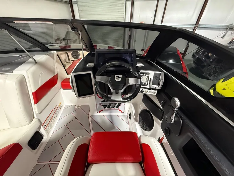 Slide: The Image of Interior of 2022 Malibu Wakesetter 25 LSV with red and white design. - 8