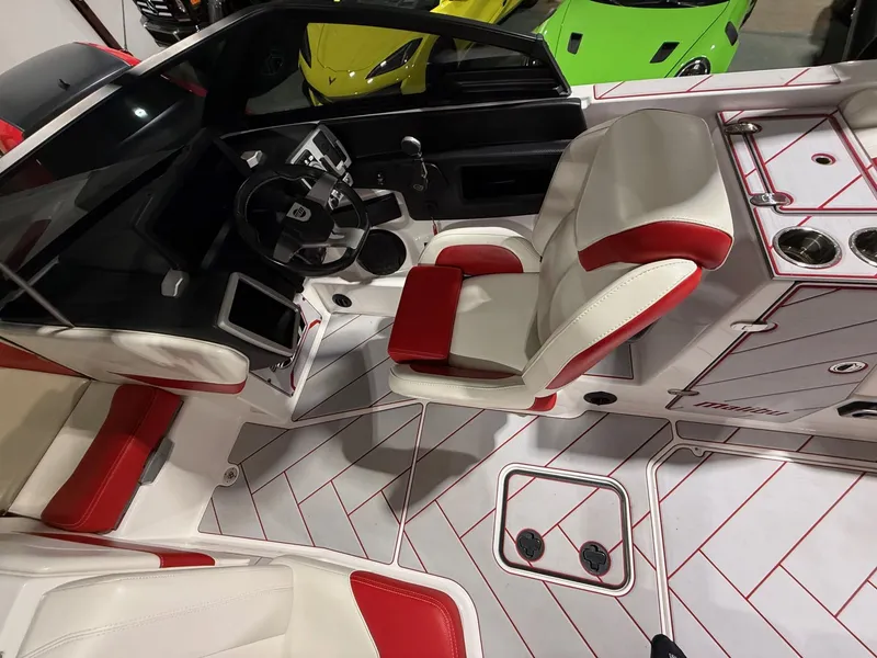 Slide: The Image of Interior of 2022 Malibu Wakesetter 25 LSV with red and white seating. - 9