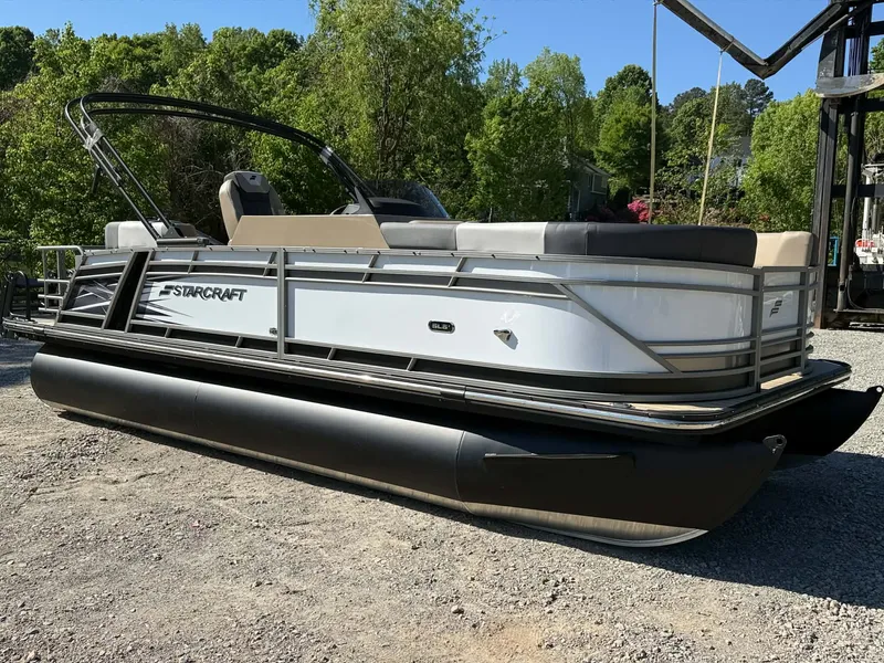 The Image of 2026 Starcraft SLS-1 R pontoon boat on gravel lot. - 1