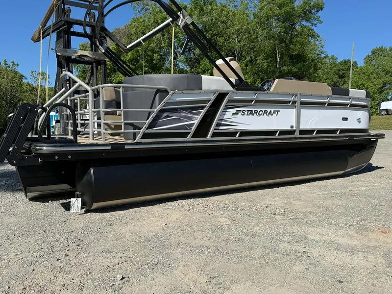 Slide: The Image of Starcraft SLS-1 R 2026 pontoon boat on gravel surface, side view. - 20