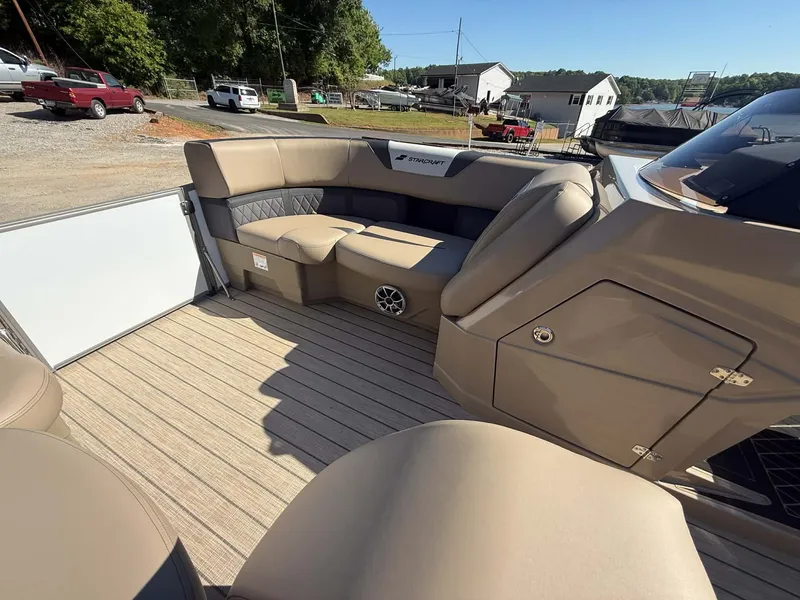 Slide: The Image of Interior of a 2026 Starcraft SLS-1 R boat with beige seating. - 23