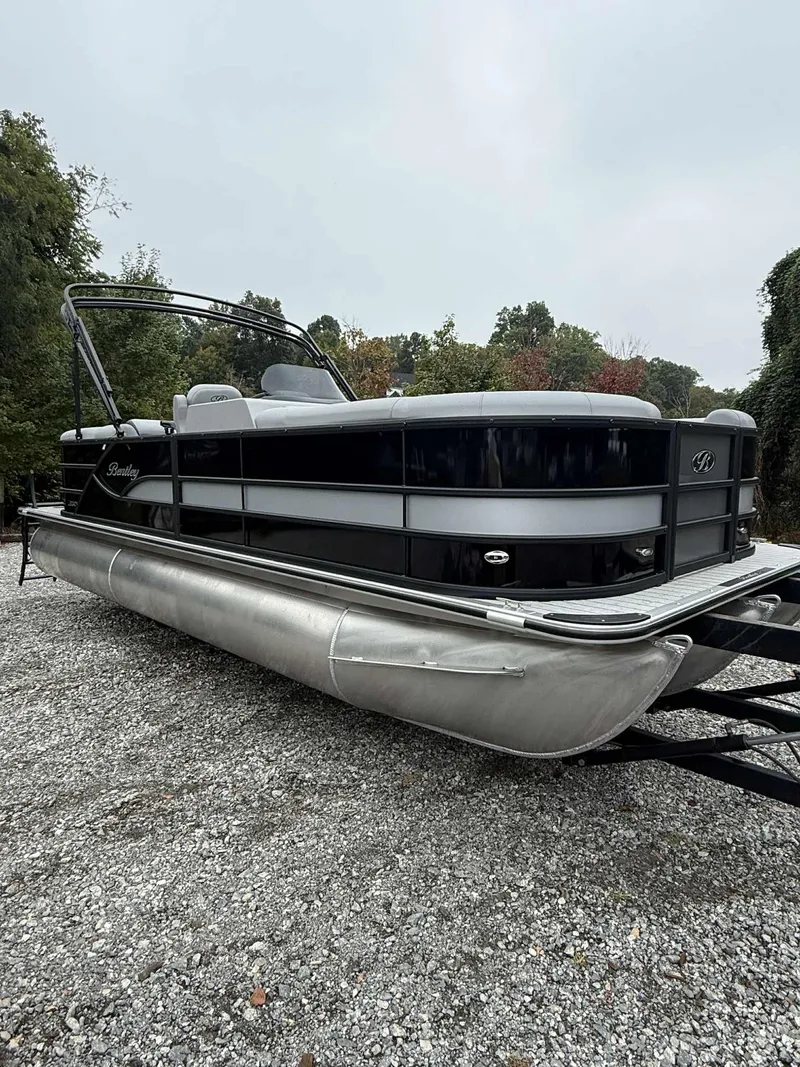 The Image of 2026 Bentley Pontoons Legacy 223 Navigator on gravel surface. - 1