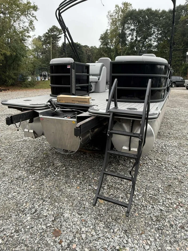 Slide: The Image of 2026 Bentley Pontoons Legacy 223 Navigator parked on gravel surface. - 13