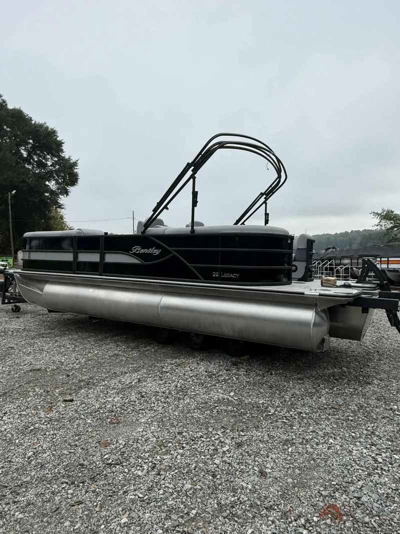 Slide: The Image of 2026 Bentley Pontoons Legacy 223 Navigator on gravel surface. - 14