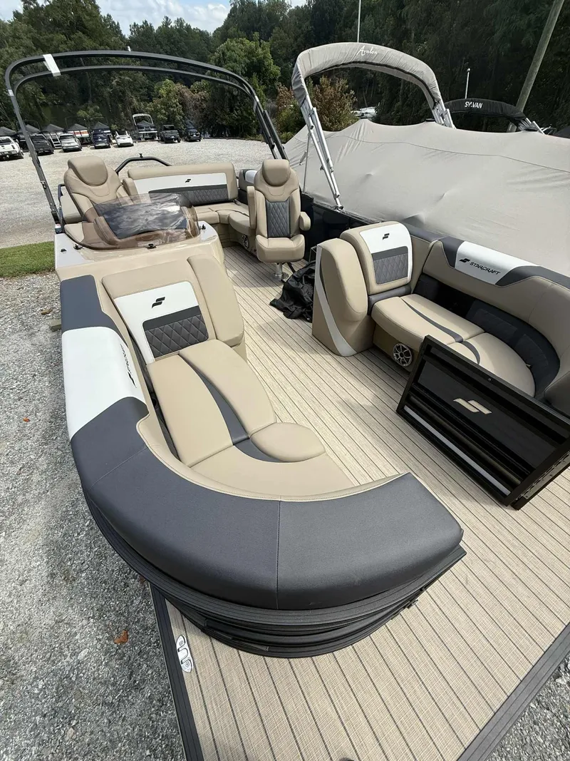 Slide: The Image of 2025 Starcraft SLS 3 Q DH pontoon boat with luxurious interior. - 5