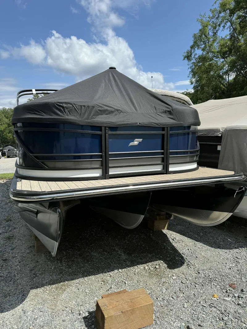 Slide: The Image of 2025 Starcraft SLS 3 Q DH pontoon boat on gravel lot. - 7