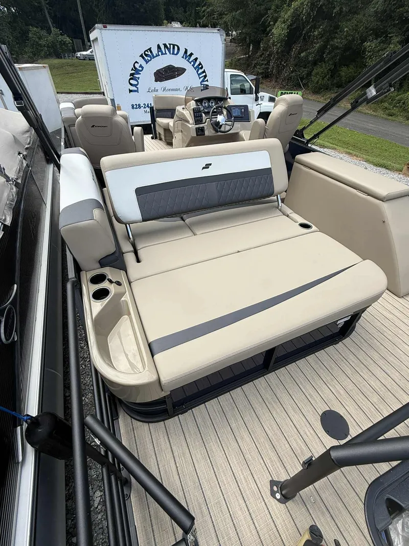 Slide: The Image of 2025 Starcraft SLS 3 Q DH pontoon boat with luxurious seating area. - 8