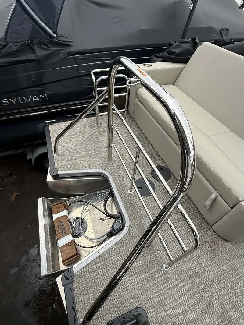 Slide: The Image of Manitou 23 Encore SLVPII 2026 pontoon boat with stainless steel railing. - 11