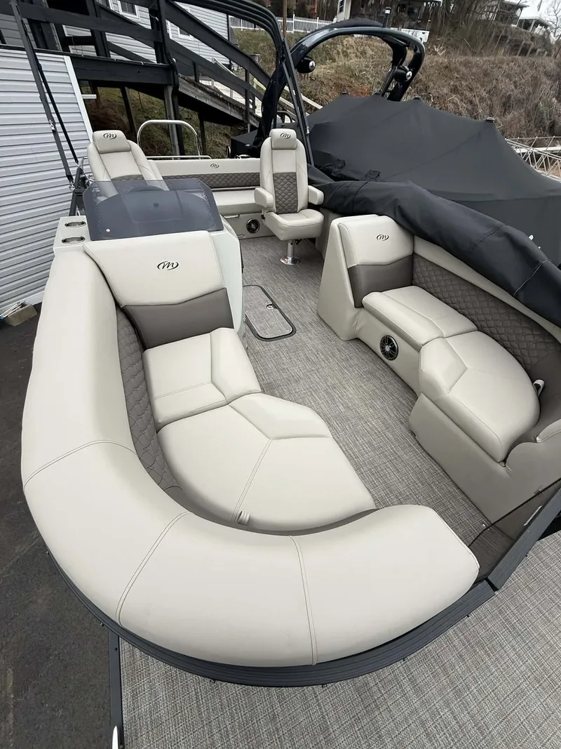 Slide: The Image of Interior of 2026 Manitou 23 Encore SLVPII with luxurious seating. - 13