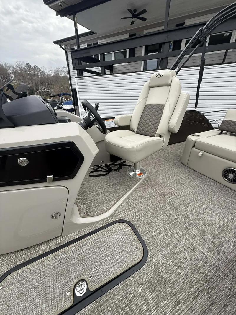 Slide: The Image of Interior of 2026 Manitou 23 Encore SLVPII with luxurious seating design. - 20