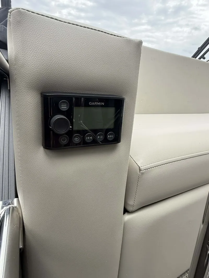 Slide: The Image of Garmin control on Manitou 23 Encore SLVPII 2026 boat. - 23