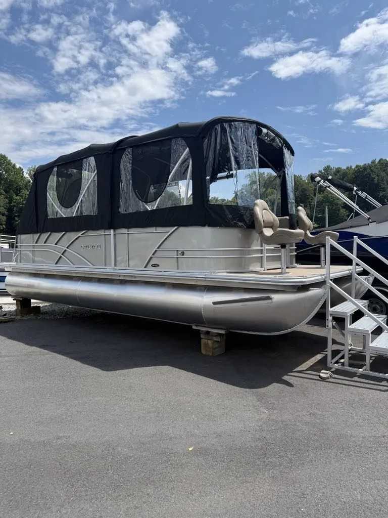 The Image of 2025 Sylvan Mirage 8524 Resorter pontoon boat on a parking lot. - 1