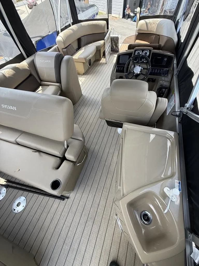 Slide: The Image of Interior of 2025 Sylvan Mirage 8524 Resorter with luxurious seating. - 12