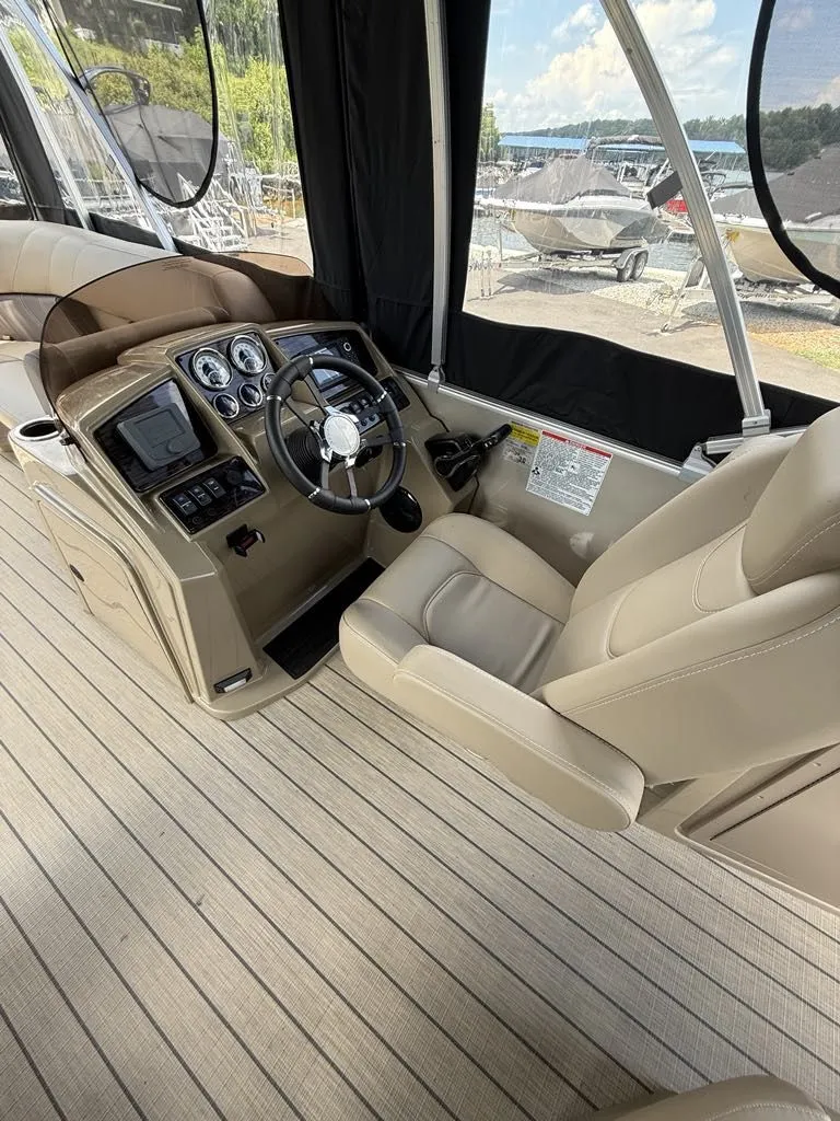 Slide: The Image of Interior of 2025 Sylvan Mirage 8524 Resorter with steering console. - 13