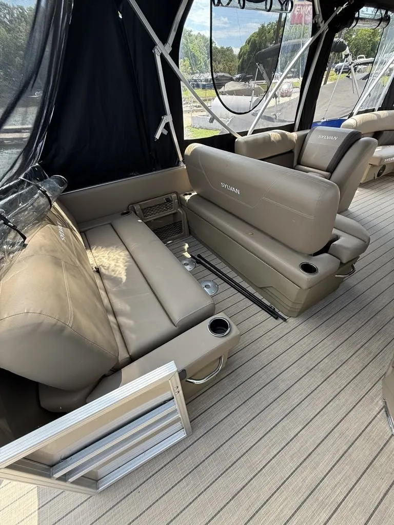 Slide: The Image of Interior of 2025 Sylvan Mirage 8524 Resorter with beige seating. - 14