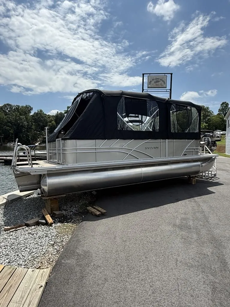 Slide: The Image of Sylvan Mirage 8524 Resorter 2025 on a dock under sunny skies. - 5
