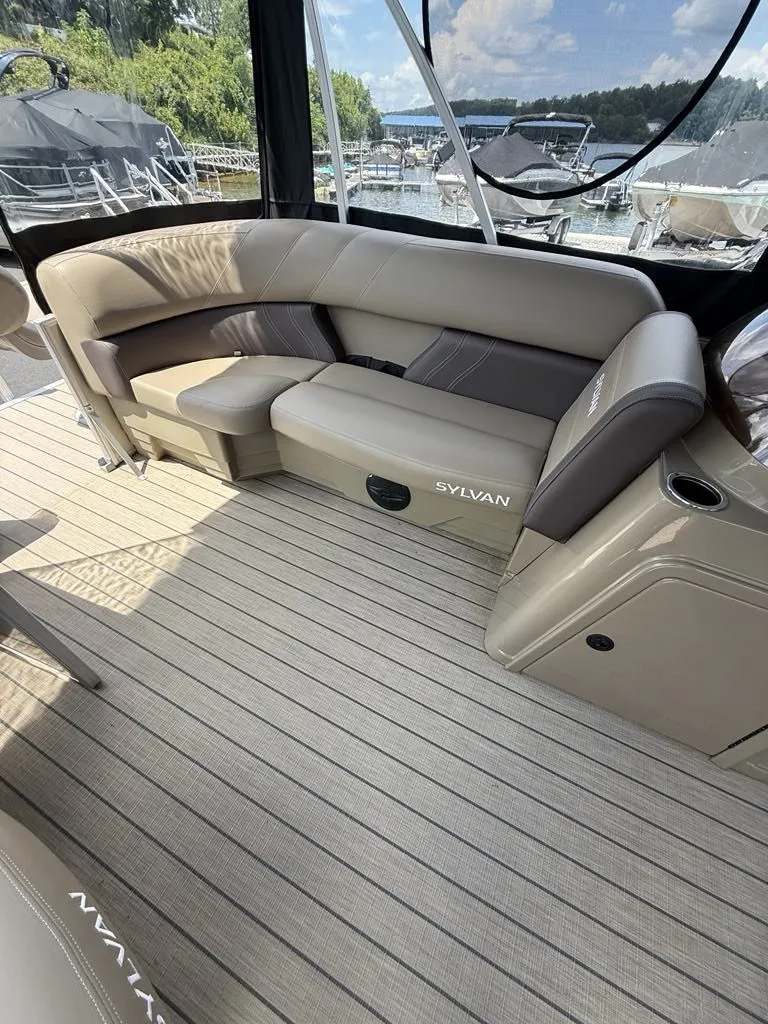 Slide: The Image of Interior of 2025 Sylvan Mirage 8524 Resorter with beige seating area. - 9