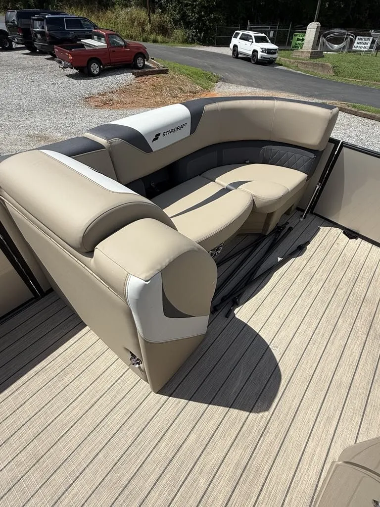 Slide: The Image of Starcraft SLS-3 2025 pontoon boat with beige seating area. - 11