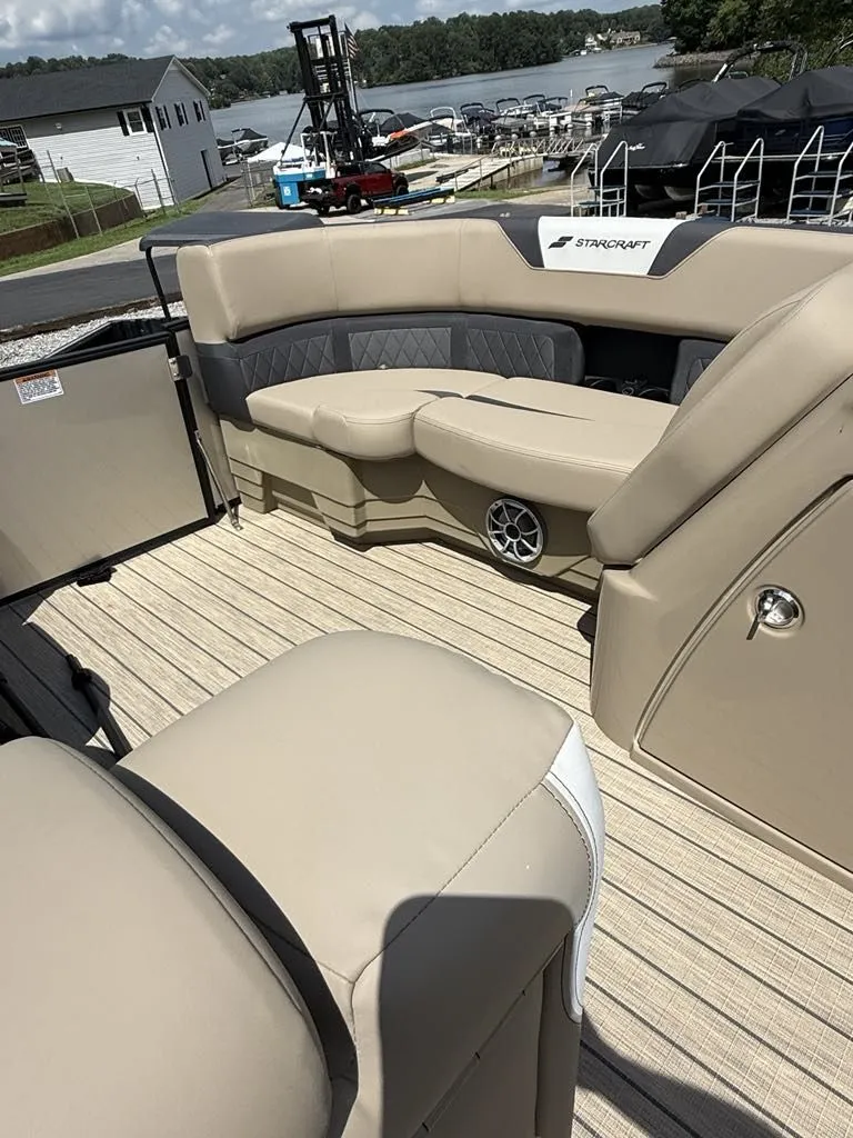 Slide: The Image of Interior of a 2025 Starcraft SLS-3 boat with beige seating. - 5