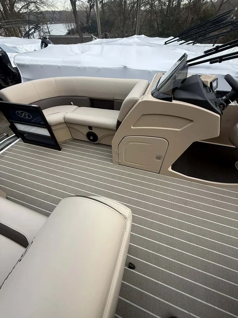 Slide: The Image of Interior of 2026 Bentley Pontoons 223 Swingback with beige seating. - 5