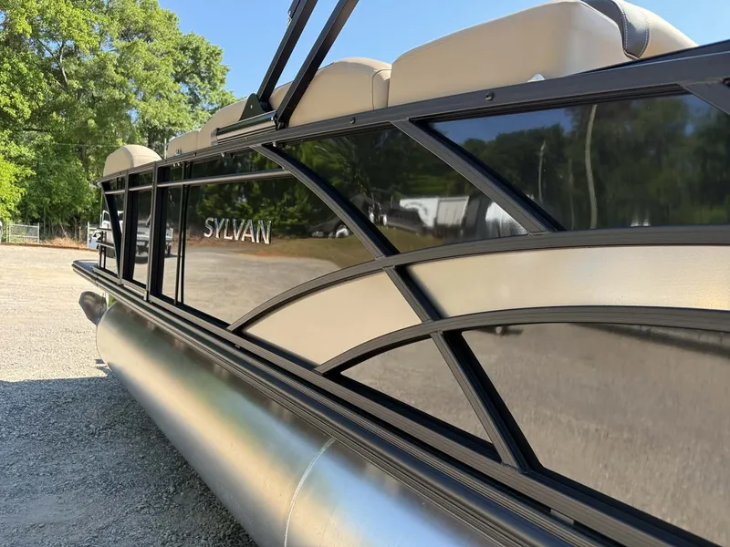 The Image of Sylvan L-3 Party Fish 2025 pontoon boat, side view outdoors. - 1