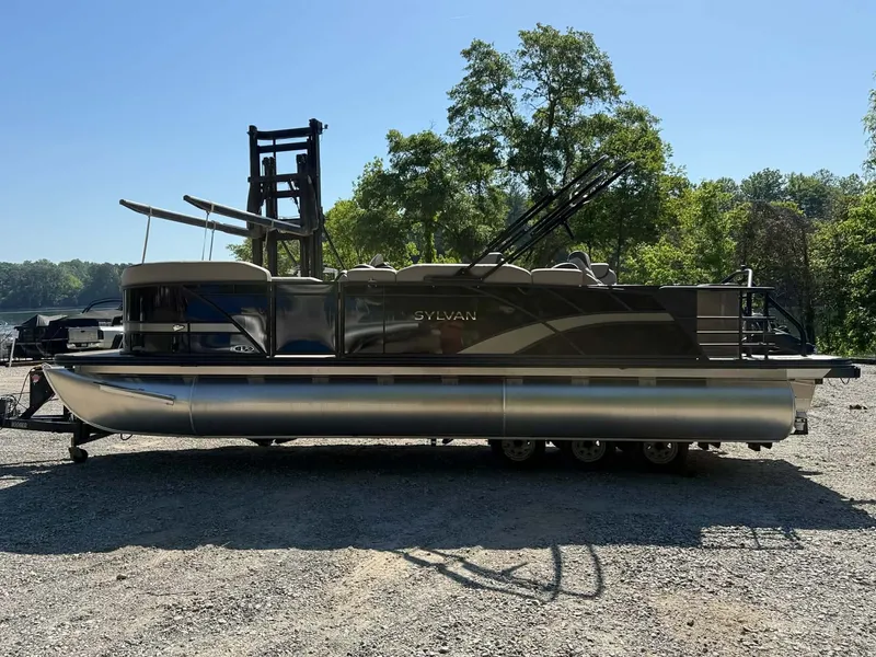 Slide: The Image of 2025 Sylvan L-3 Party Fish pontoon boat on a trailer. - 40