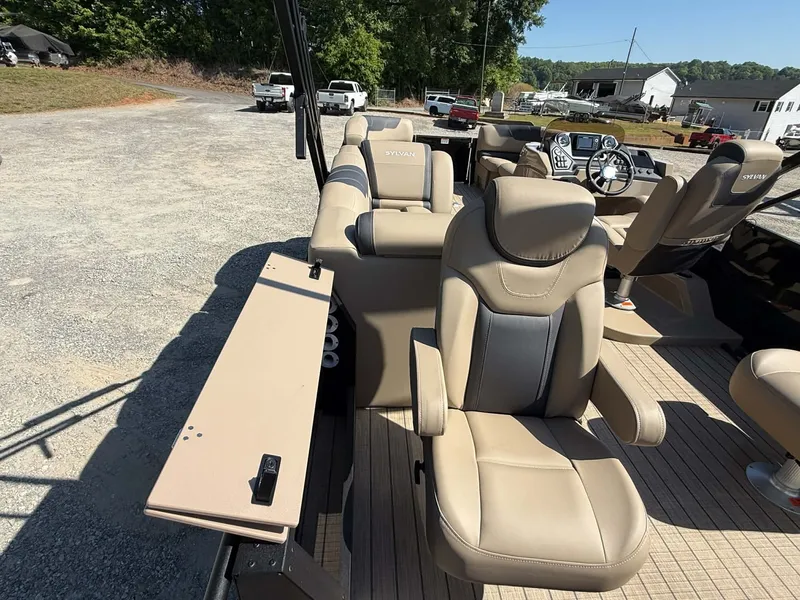 Slide: The Image of Interior of 2025 Sylvan L-3 Party Fish with beige leather seats. - 6