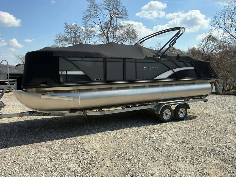 Slide: The Image of 2026 Sylvan L-3 LZ DH pontoon boat on trailer, covered. - 16