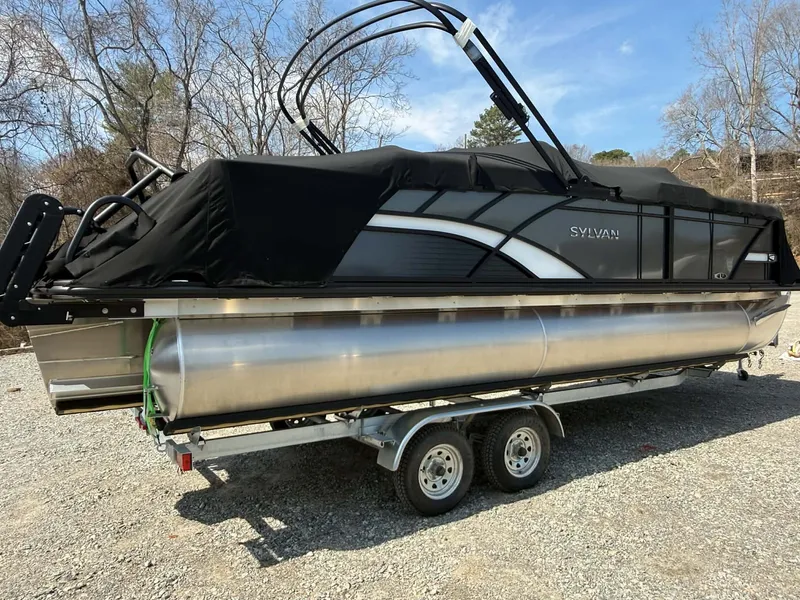 Slide: The Image of 2026 Sylvan L-3 LZ DH pontoon boat on trailer, covered. - 23