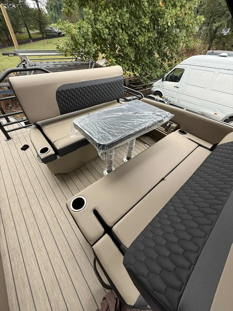 Slide: The Image of Interior of 2026 Sylvan L-3 DLZ with seating and table. - 11