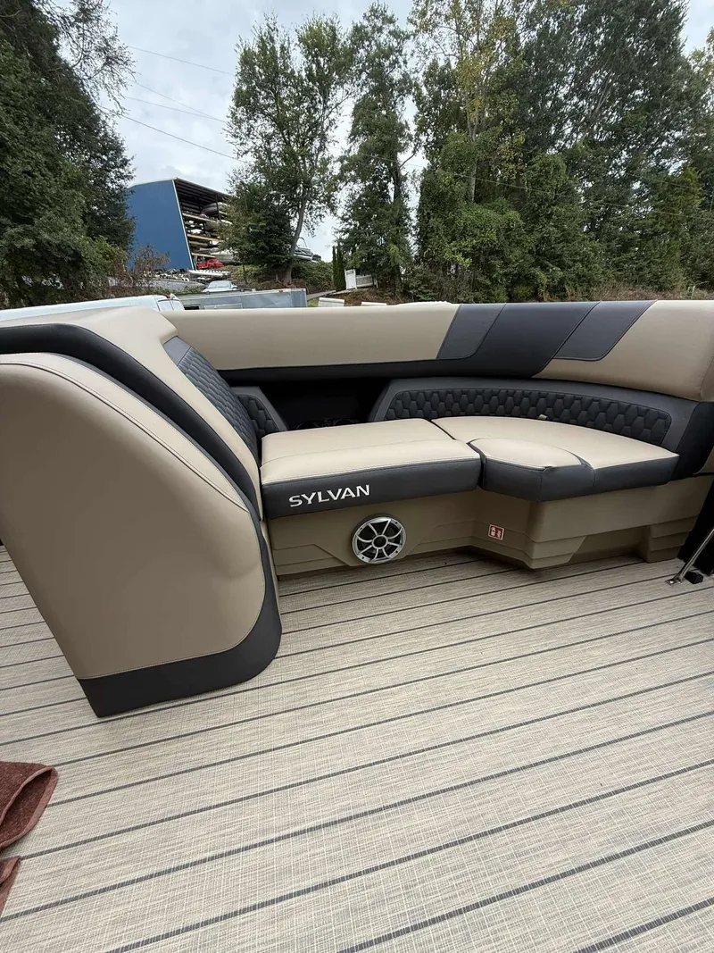 Slide: The Image of 2026 Sylvan L-3 DLZ boat interior with beige seating. - 12
