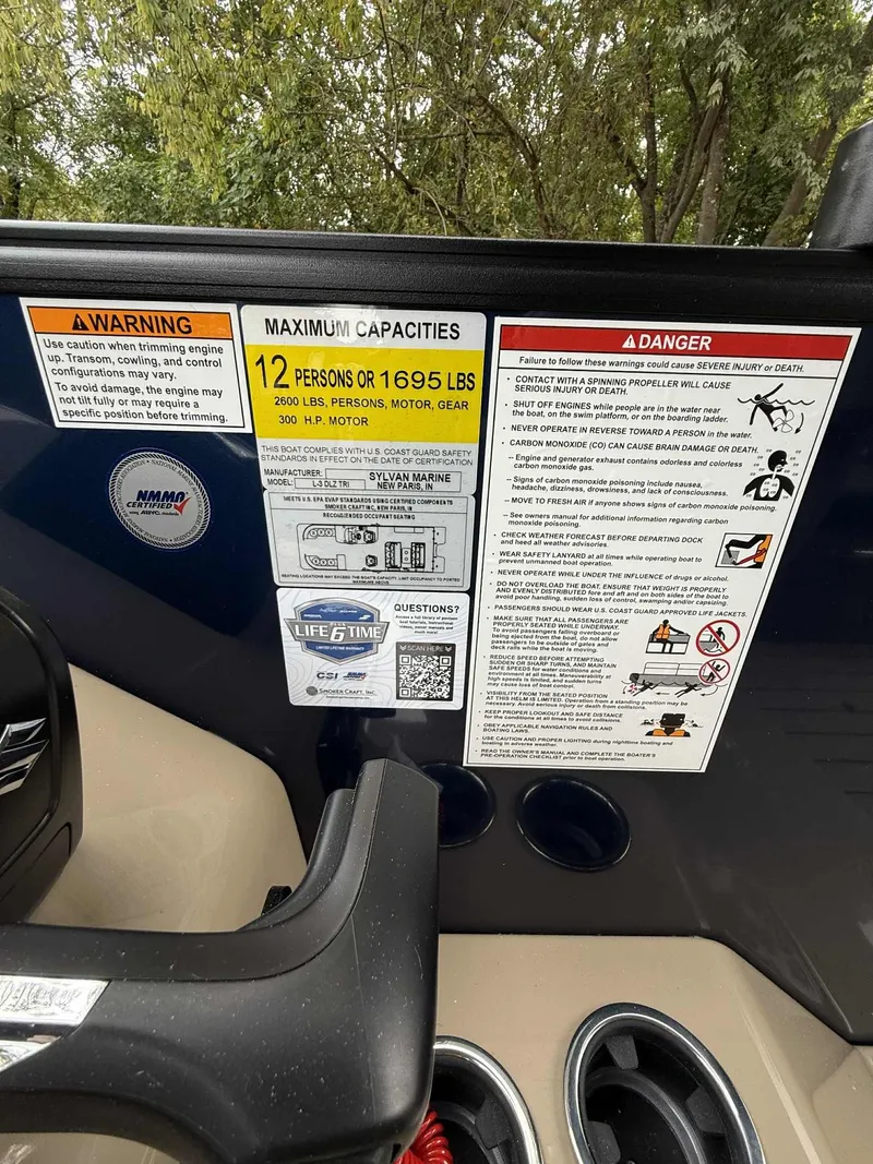 Slide: The Image of Sylvan L-3 DLZ 2026 boat capacity and safety warnings. - 7