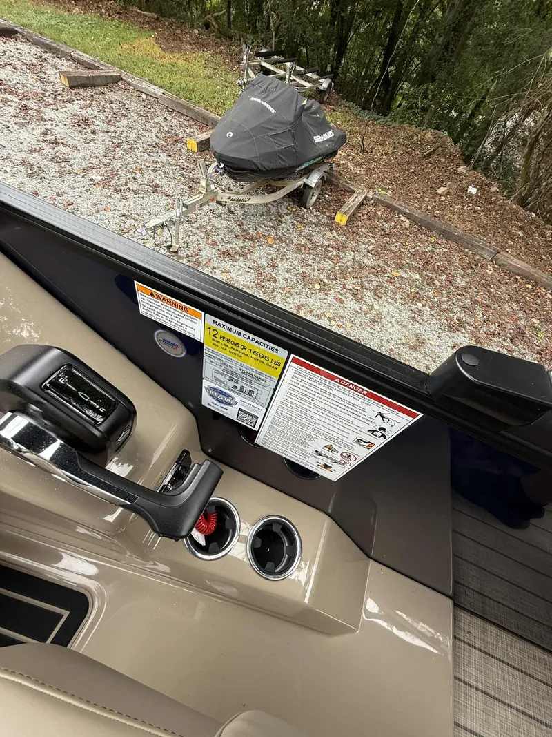 Slide: The Image of Interior view of a 2026 Sylvan L-3 DLZ boat with control console. - 8