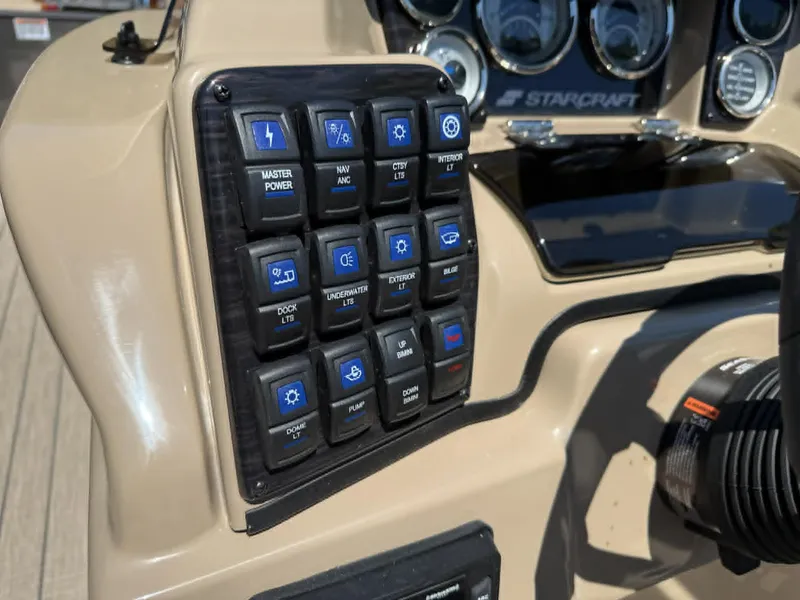 Slide: The Image of Dashboard of 2025 Starcraft SLS-3 with switches and gauges. - 16