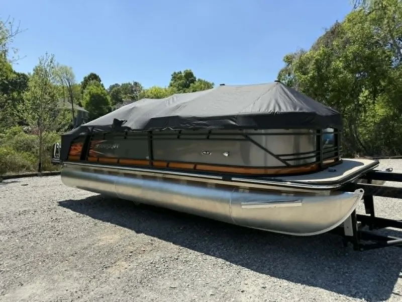 Slide: The Image of 2025 Starcraft SLS-3 pontoon boat with cover on trailer. - 25