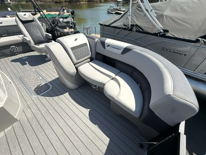 Slide: The Image of Starcraft SLS-3 DL DH Bar 2026 pontoon boat with luxurious seating. - 13