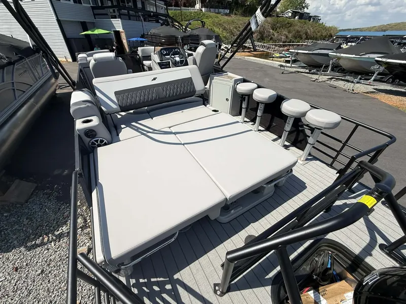 Slide: The Image of 2026 Starcraft SLS-3 DL DH Bar pontoon boat with lounge area and bar stools. - 15