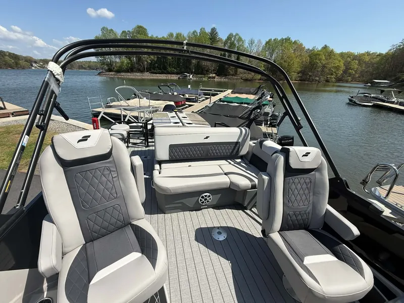 Slide: The Image of 2026 Starcraft SLS-3 DL DH Bar pontoon boat by the lake. - 16