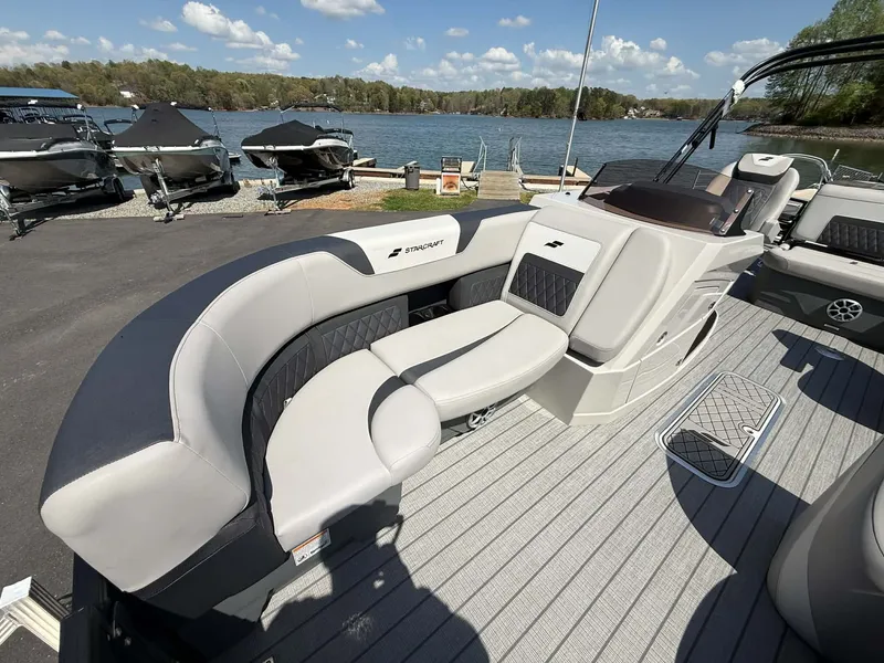 Slide: The Image of 2026 Starcraft SLS-3 DL DH Bar pontoon boat by the lakeside. - 17