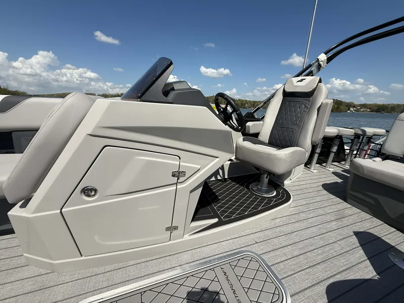 Slide: The Image of 2026 Starcraft SLS-3 DL DH Bar boat cockpit with gray seating. - 5