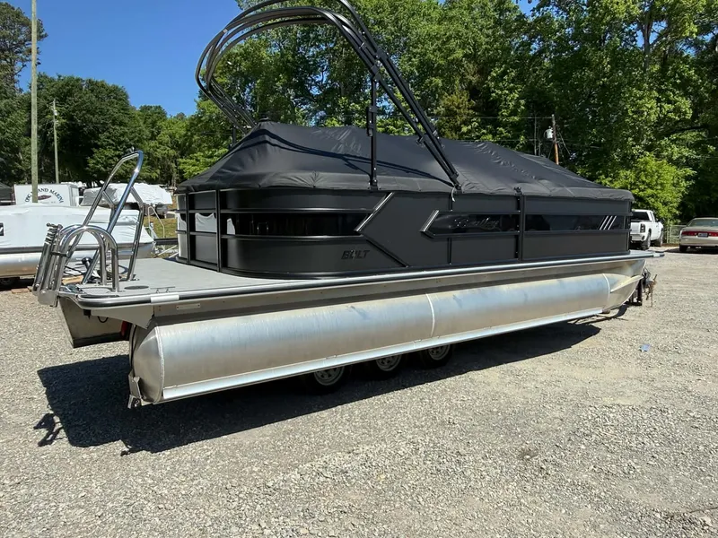 Slide: The Image of 2026 Bentley Pontoons 223 Bolt with cover parked outdoors. - 32