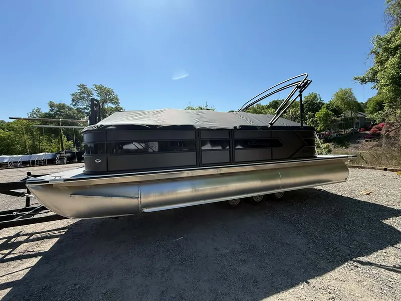 Slide: The Image of 2026 Bentley Pontoons 223 Bolt on gravel lot under sunny sky. - 33