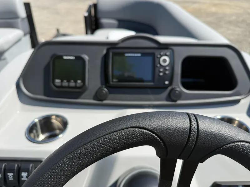 Slide: The Image of Dashboard of 2026 Bentley Pontoons 223 Bolt with steering wheel and screens. - 8