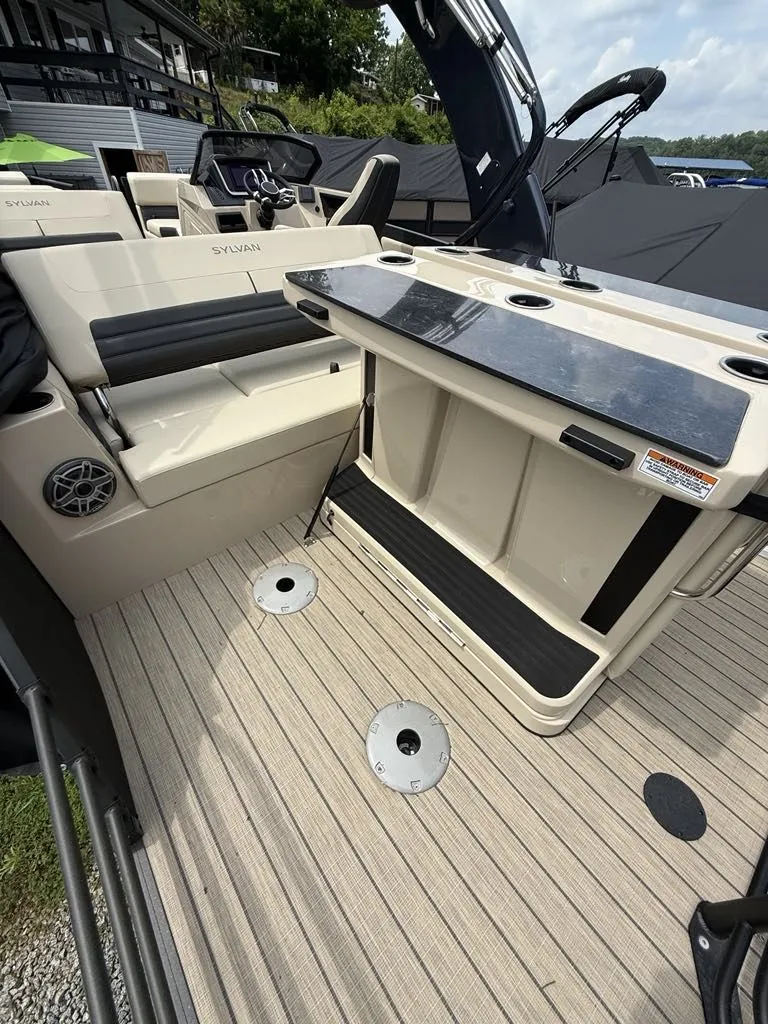 Slide: The Image of Interior of Sylvan G3 DLZ Bar 2025 with seating and table. - 15