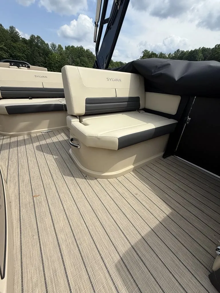 Slide: The Image of Interior of 2025 Sylvan G3 DLZ Bar with beige seating. - 16